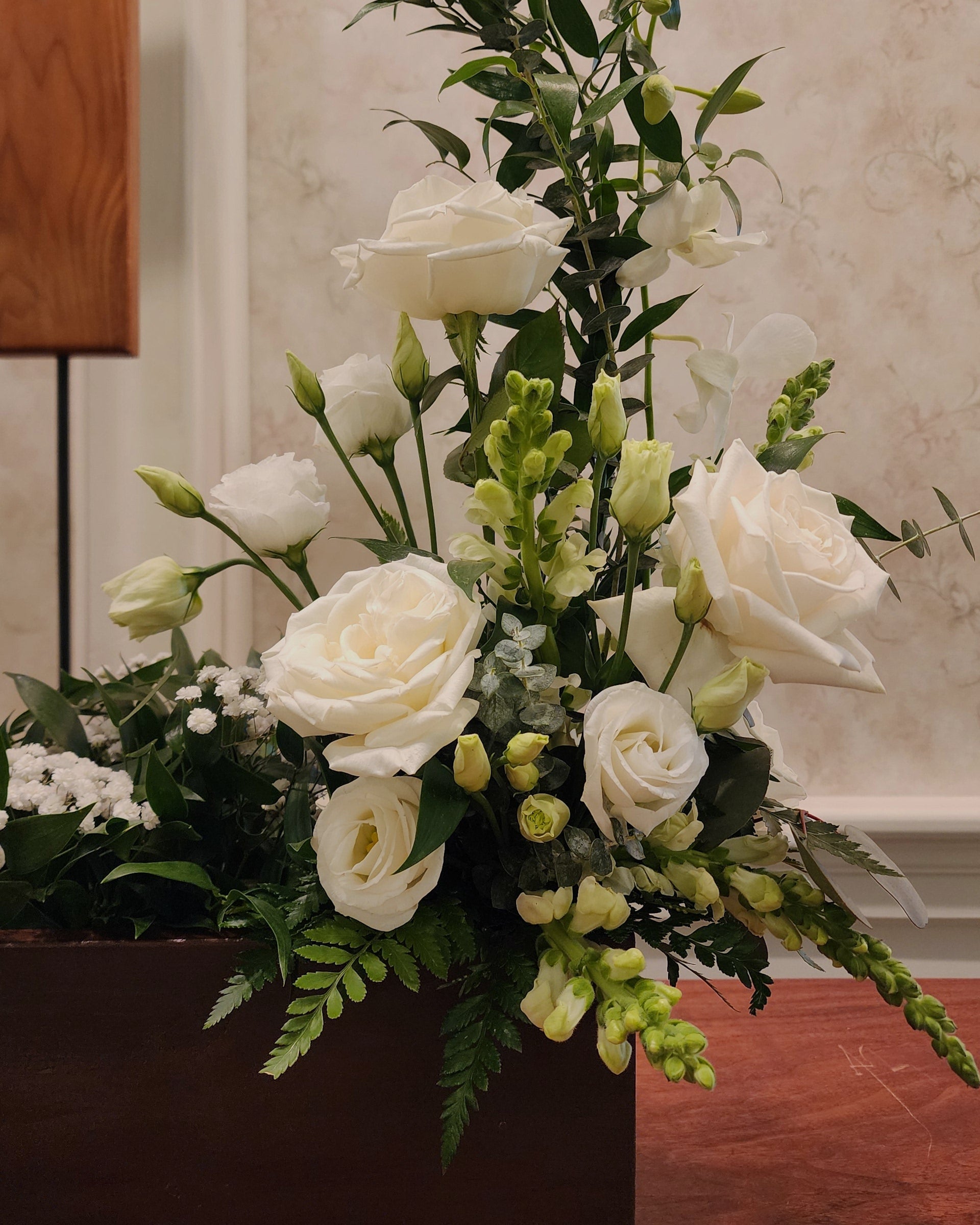 Photo of a portion of a funeral arch floral arrangement - Services - Funerals