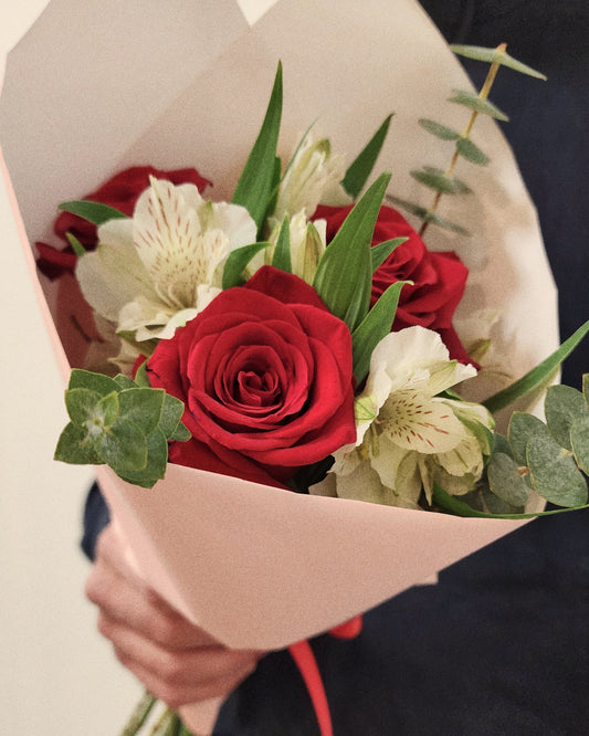 Photo of a man holding Jerry's Bouquet